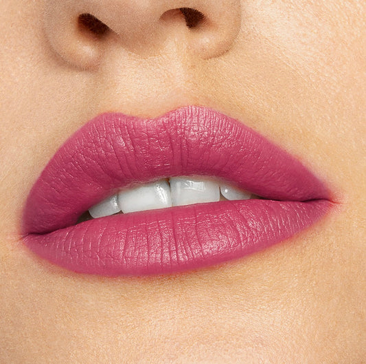 Lips wearing ColourPop Lippie Stix Byron Babe, a cool‑toned mauve pink, delivering smooth, opaque color with a soft‑matte finish in a close-up studio beauty shot.