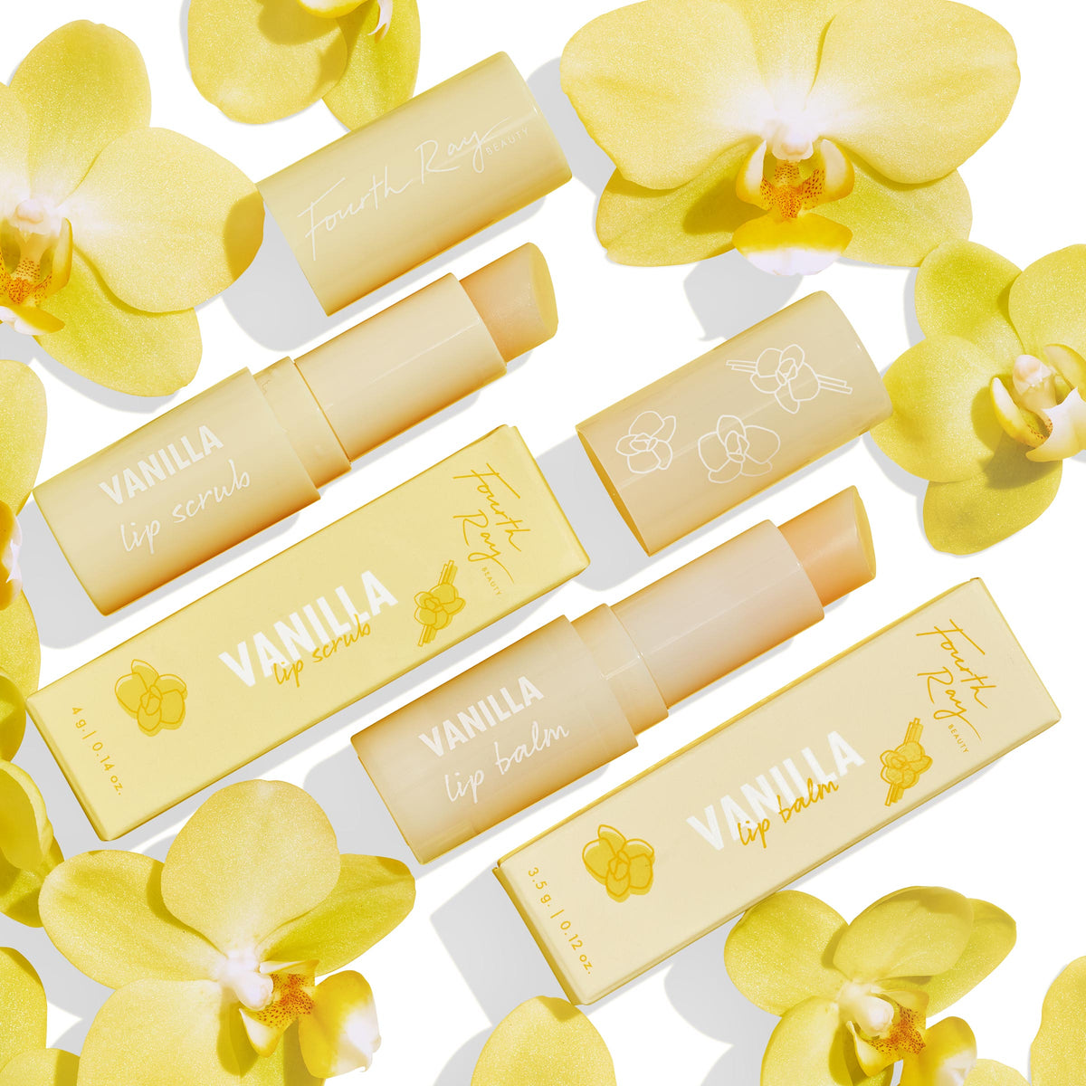 Vanilla Kisses Lip Care Set showcases ColourPop Lip Scrub and lip balm, tubes uncapped to reveal product, in soft-yellow Fourth Ray Beauty packaging with orchid graphics, arranged flat on a white background among yellow orchid flowers.
