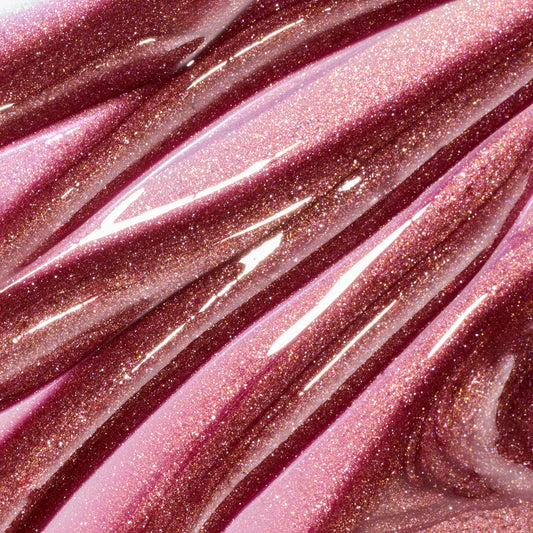 Chocolate Cherry Fresh Kiss Glossy Balm by Colourpop flowing in thick swatches, a sheer black cherry Lip Gloss & Lip Oil shade packed with silver and gold shimmer against a close-up studio background.