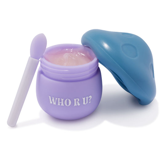 Pure Madness ColourPop Lip Mask jar opened, showing glossy pink balm inside a lilac pot labeled 'WHO R U?', with a blue mushroom-cap lid set aside and a matching lilac spatula applicator, studio white background.