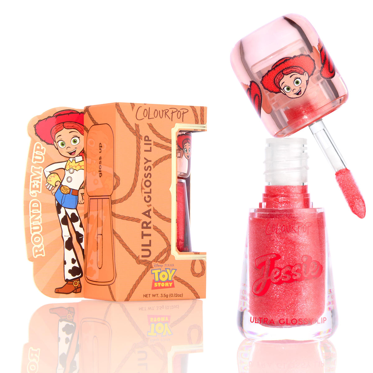 ColourPop Ultra Glossy Lip Yeehaw shows a coral-red, glittery gloss as the doe-foot applicator lifts from the open tube marked Jessie, displayed beside a Disney Pixar Toy Story Jessieβthemed box on a bright white background.