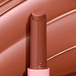 PSL balm stick displays a twist-up, rounded bullet in a warm pumpkin-spice nude against matching glossy swatches; ColourPop So Juicy Plumping Gloss Balm with Peptides showcases a creamy, plumping finish in a pink-accented tube.