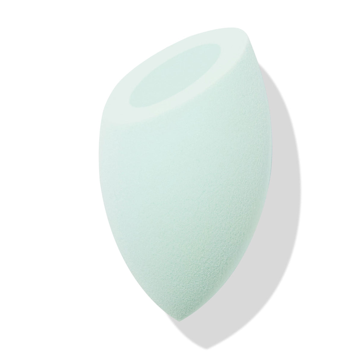 Mint green Silicone Blending Sponge dabs foundation and concealer, featuring a teardrop body with pointed tip and flat top with circular well, shown angled on a white backdrop with soft shadow; ColourPop Makeup Tools & Accessories.