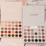 Bold + Bare ColourPop Shadow Palette Set displaying two open 30-pan palettes - warm neutrals and coppers on the left, cool taupes, mauves, and charcoals on the right - with matte and shimmer finishes, on a beige background with branded sleeves.