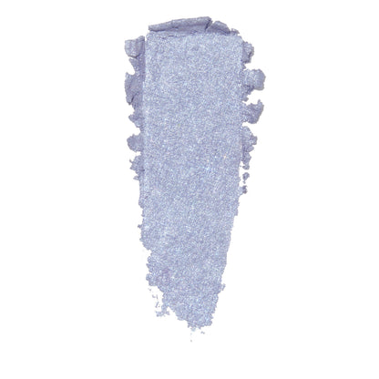 Thick vertical smear of icy lilac eyeshadow with blue-silver shimmer and ragged edges on white, showcasing the finish of ColourPop Moon Daisy Super Shock Shadow.
