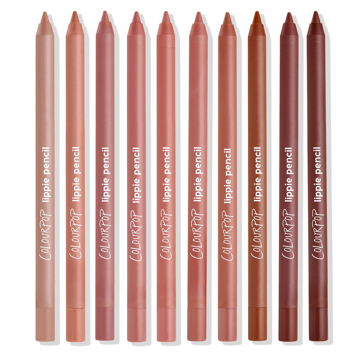 ColourPop Truth or Bare Lippie Pencil kit standing upright in a neat row, ten lip liner pencils in nude, pink, mauve, terracotta, and brown tones on a white background, with ColourPop “lippie pencil” branding visible.