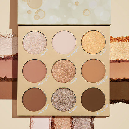 ColourPop Feelin' Bubbly shadow palette open, showing a 9-pan range of champagne, gold, taupe, and brown shades in matte and shimmer finishes, set on a cream backdrop with pigment swatches and bubbly-themed beige packaging.