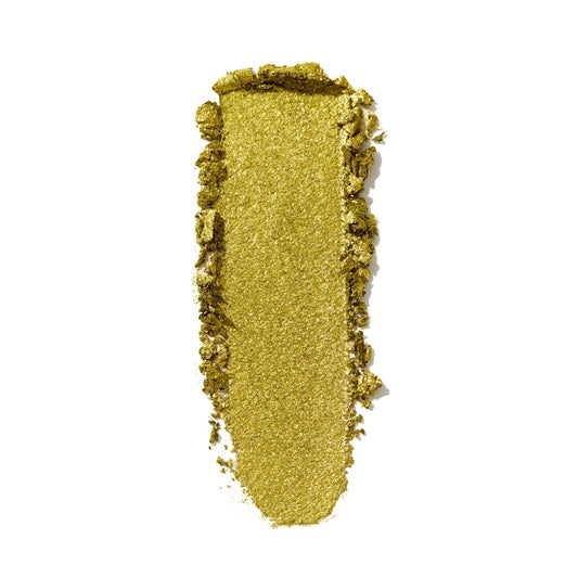 Shimmery lime-green eyeshadow swatch spreads vertically with textured edges on a white background, showcasing ColourPop Super Shock Shadow in Green Juice, a metallic, glittery finish for bold, high-shine eye looks.