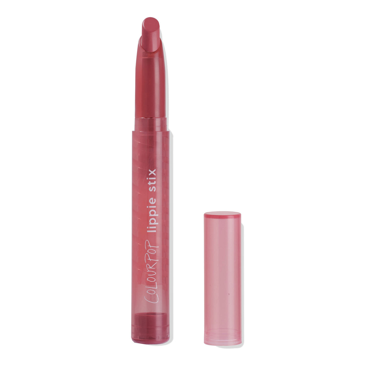 ColourPop Little Tings Lippie Stix standing uncapped with bullet twisted up, showcasing a warm rosy pink shade in a translucent blush tube, cap set beside it on a white background.