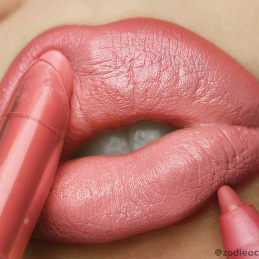 Starship Lippie Pencil lining and filling close-up lips in a creamy coral-pink, highlighting smooth, satin finish and crisp edges; ColourPop Lippie Pencil offers precise definition for a bold, everyday look.