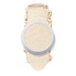 ColourPop Stole the Show Super Shock Highlighter in a round white pot sits atop a thick champagne‑pearl swatch on a white background, showing its luminous shimmer finish for face highlighting.