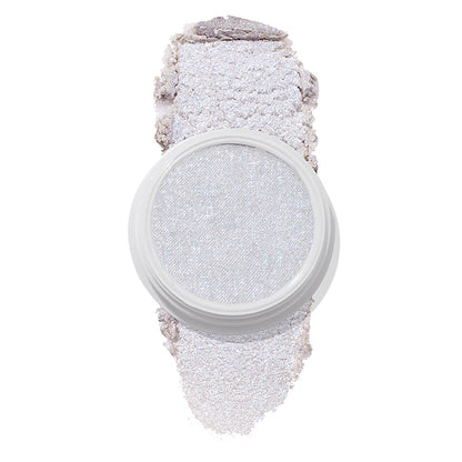 ColourPop Honeymoon Super Shock Highlighter in a white round pot, showing a pale icy-lilac, opalescent shimmer with iridescent sparkle, and a soft crushed swatch smeared above and below the pan on a white background.