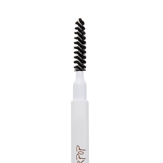 ColourPop Black N' Brown Pencil brow pencil spoolie brushing and shaping eyebrows, close-up of black spiral bristles on a white barrel with partial logo, isolated on a white background.