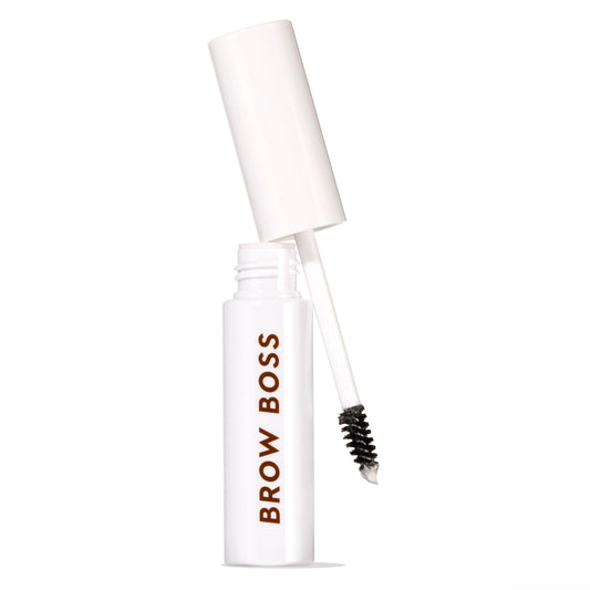 White Brow Boss Gel Clear tube with open cap and spoolie wand angled out, showing translucent formula for shaping and setting eyebrows, isolated on white background for brow makeup product display.