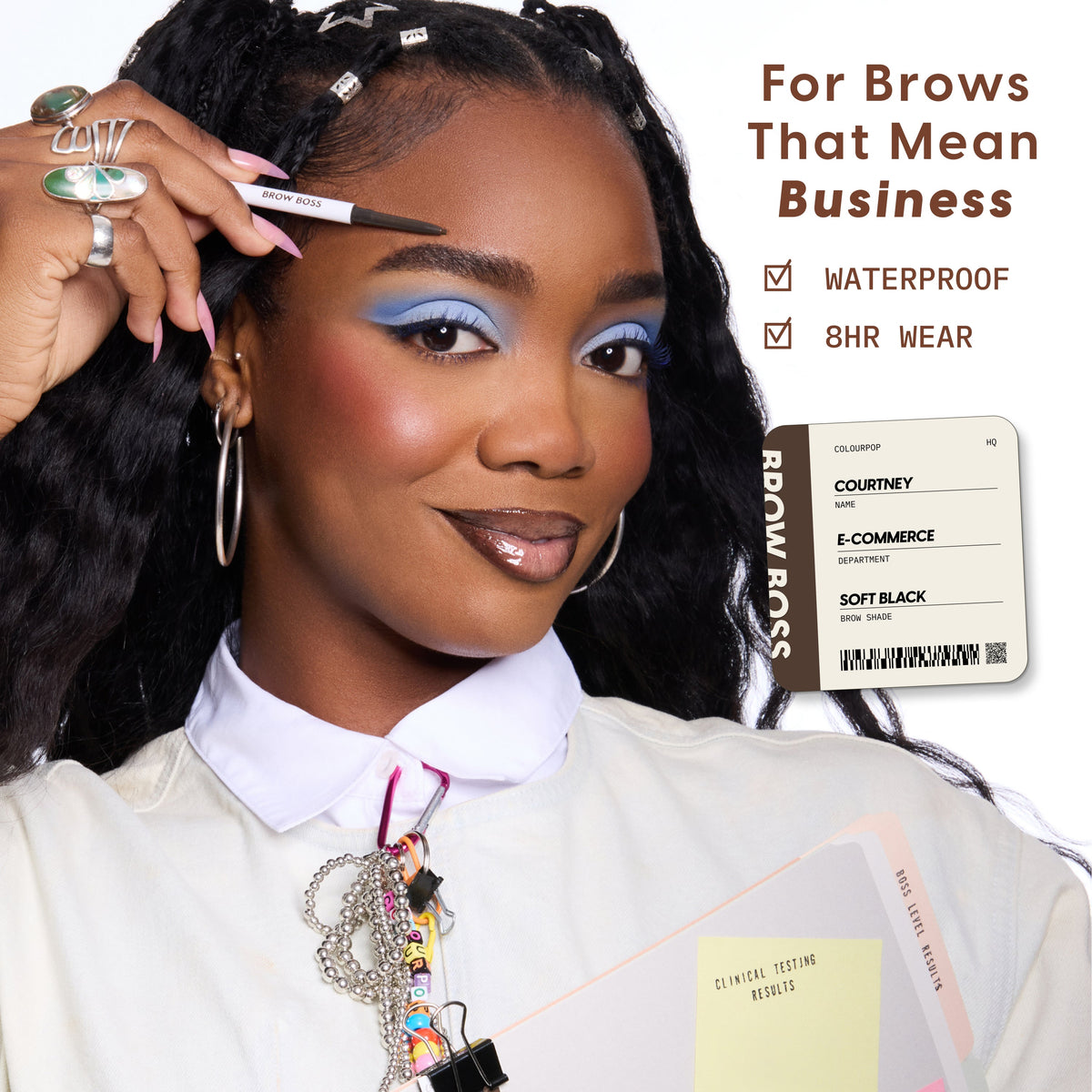 Confident woman applies ColourPop Brow Boss Pencil in Taupe to sculpted brows, showcasing polished brow makeup with bold blue eyeshadow, while text highlights waterproof, 8-hour wear benefits in a professional office-inspired setting.