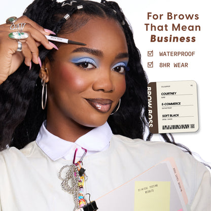 Confident woman applies ColourPop Brow Boss Pencil in Taupe to sculpted brows, showcasing polished brow makeup with bold blue eyeshadow, while text highlights waterproof, 8-hour wear benefits in a professional office-inspired setting.