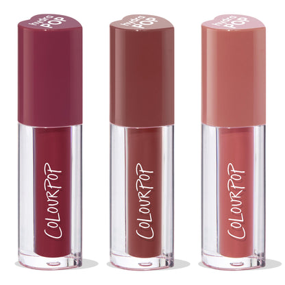 Trio of ColourPop Lip Stain, Everyday Besties, standing upright - clear tubes with ColourPop logo and heart-shaped caps in deep berry, warm mocha, and soft rosy nude shades, grouped as a bundle on a white background.