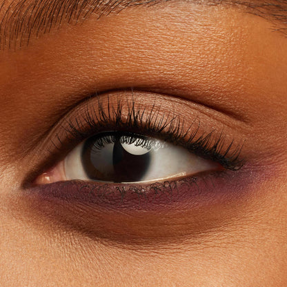 Eye showcases Charmer Crème Gel Liner gliding along the waterline and lower lash line, a rich plum shade with a creamy semi-matte finish, shown as a beauty swatch for the ColourPop Crème Gel Liner.