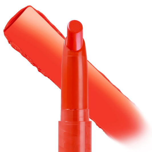 Chi Chi ColourPop Lippie Stix shown uncapped with a bold warm coral-red swatch behind it, close-up on a white background highlighting the creamy, high-pigment payoff and slim stick packaging.