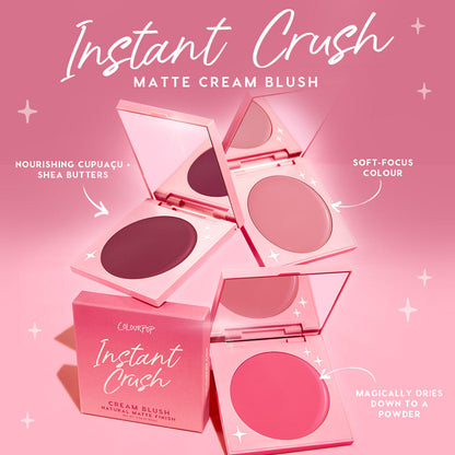 Whole Mood ColourPop Cream Blush compact displayed open among the Instant Crush matte lineup, rosy pans with mirrors on a pink backdrop, emphasizing soft‑focus color that dries to a powder and cupuaçu + shea butter nourishment.