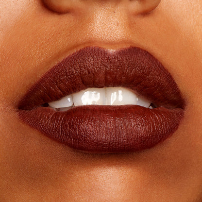 Full lips wearing CTRL, a ColourPop Lippie Pencil, lined and filled in a deep chocolate brown matte shade, showing clean edges and smooth, opaque coverage in a studio close-up.