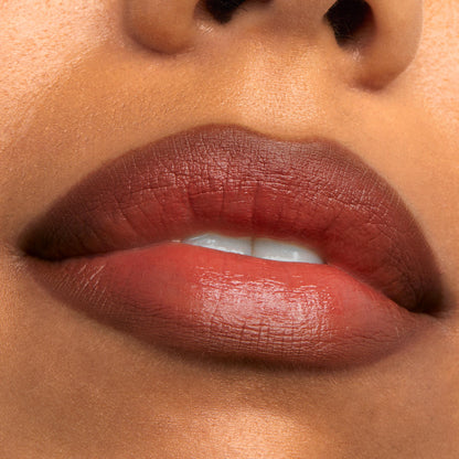 ColourPop Chain Reaction Lippie Pencil defining and filling lips in a warm terracotta-brown shade with a soft sheen, shown in an extreme close-up beauty swatch for precise lip lining and all-over color.