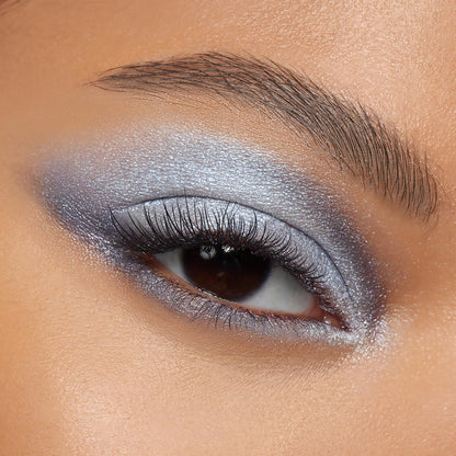 Shimmering silver-blue smokey eye applied with Cloud 9 ColourPop Shadow Palette, featuring a metallic lid, diffused crease, bright inner-corner highlight, and defined lashes in a tight close-up of one eye.