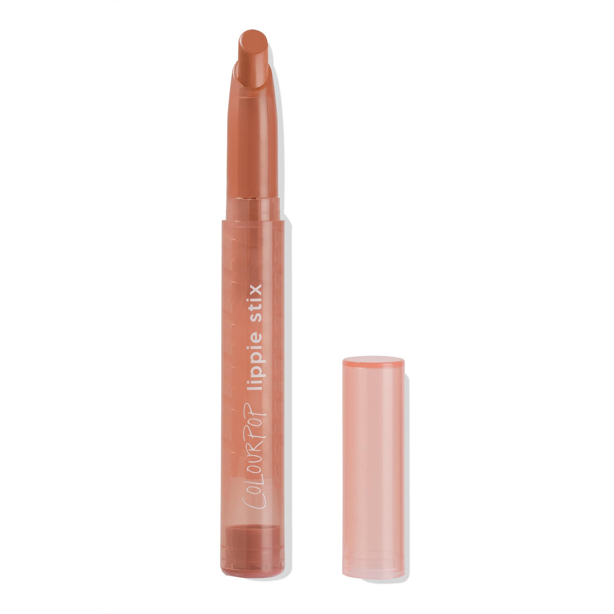 ColourPop Lippie Stix in Cookie extends from a translucent peach twist-up tube, uncapped with the cap beside it, revealing a warm nude-brown angled bullet; slim packaging with white logo on a clean white background.