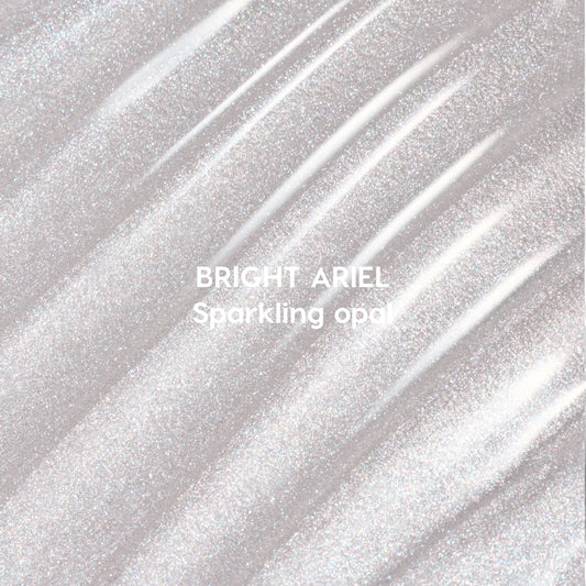 Bright Ariel Ultra Glossy Lip swatch showing shimmering sparkling opal gloss in wavy strokes against a light background, highlighting high-shine Disney Princess inspired lip color texture for US makeup lovers.