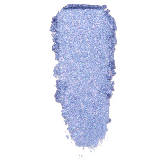 Dream Much ColourPop Super Shock Shadow swatch, a creamy periwinkle‑lavender eyeshadow with icy blue shimmer and pink sparkles, smeared in a single swipe to show metallic, high‑shine payoff on a white background.