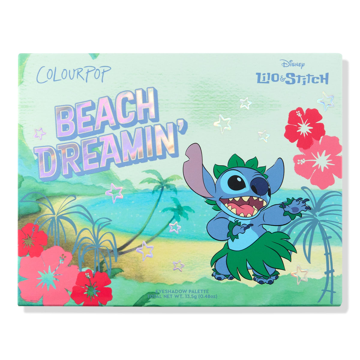 Beach Dreamin’ ColourPop Shadow Palette featuring mint-green packaging with a holographic title and Disney Lilo & Stitch art - Stitch dancing in a grass skirt against a Hawaiian beach scene with palms, hibiscus, and star accents.