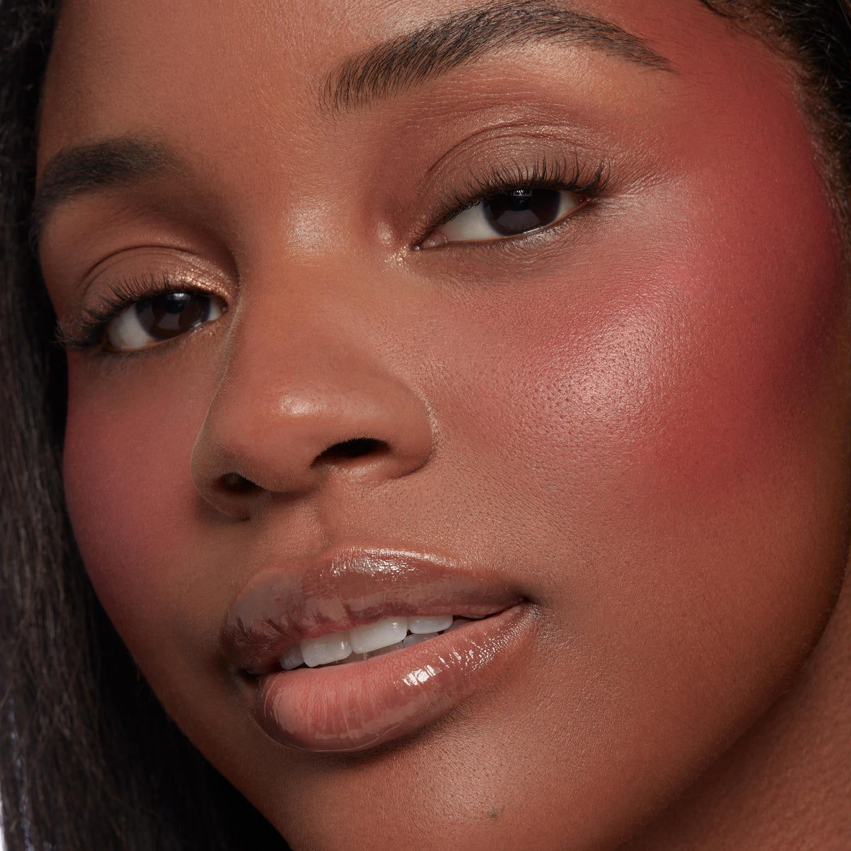 Neutral nude shimmer and matte shades from the Nude Mood ColourPop Shadow Palette blended on the eyelids, captured in a close-up with rosy cheeks and glossy lips, showcasing soft everyday tones and a smooth, luminous finish.