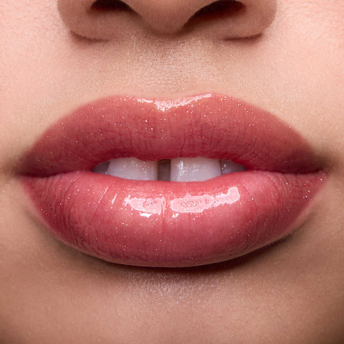 Close-up swatches of Colourpop Fresh Kiss Glossy Balm in Chocolate Cherry on lip tones, showing sheer berry shine with subtle shimmer, promoting Lip Gloss & Lip Oil finish and smooth, hydrated lips.