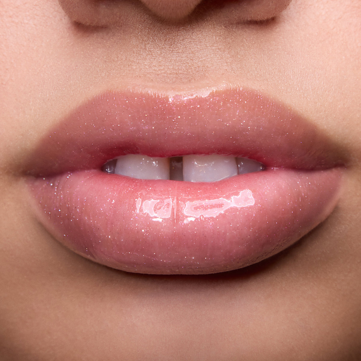 Close-up of models’ lips wearing Colourpop Fresh Kiss Glossy Balm in Raspberry Crème, showing sheer pink shimmer Lip Gloss & Lip Oil finish on different skin tones against a simple studio background.