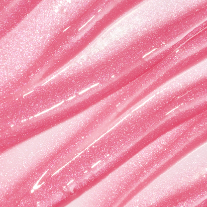 ColourPop Fresh Kiss Glossy Balm swatch in Raspberry Crème, showing sheer pink Lip Gloss & Lip Oil texture with shimmering pink and silver sparkles in smooth diagonal streaks against a glossy background.