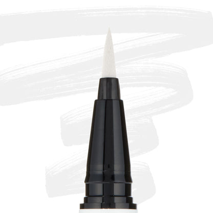 ColourPop BFF Liquid Liner Graceland creating bold white strokes with a fine felt tip; close-up of the black pen barrel and pointed brush, white eyeliner swatches behind, for precise wings and graphic eye looks.