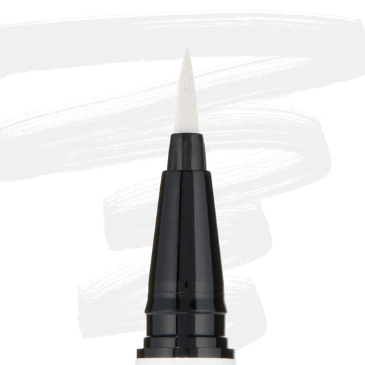 ColourPop BFF Liquid Liner Graceland creating bold white strokes with a fine felt tip; close-up of the black pen barrel and pointed brush, white eyeliner swatches behind, for precise wings and graphic eye looks.