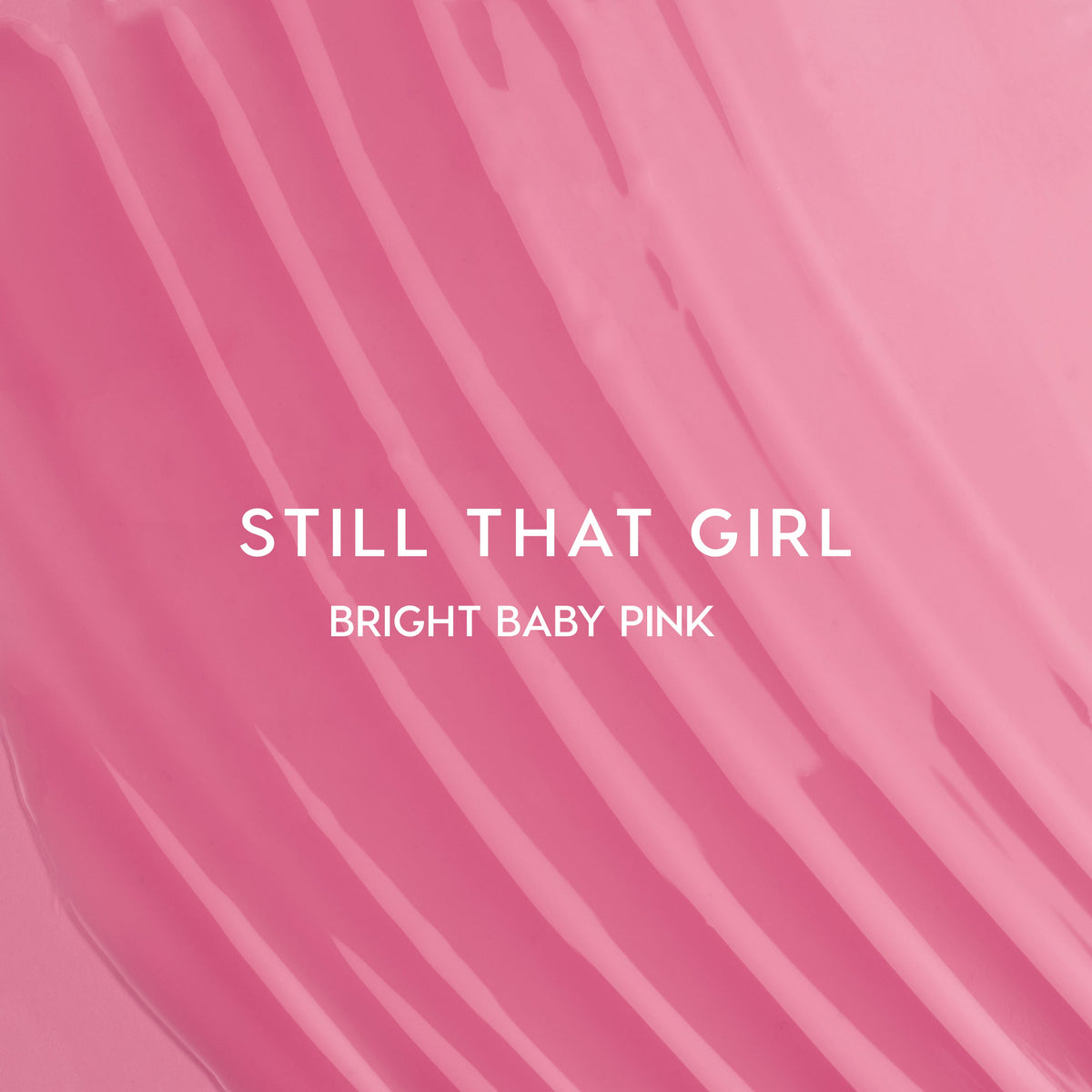 Still That Girl Ultra Glossy Lip Heart to Get swatch showing smooth, bright baby pink lip gloss spread in soft ridges across a solid pink background, highlighting its high-shine, creamy texture for bold, glossy lips.