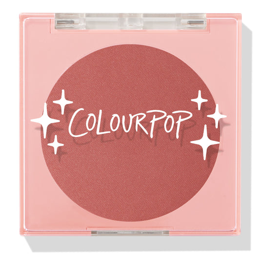 Just Cruisin’ ColourPop Pressed Powder Blush shown closed in a pink square compact with a clear lid and white sparkles logo, revealing a matte warm rose terracotta pan on a clean white background.