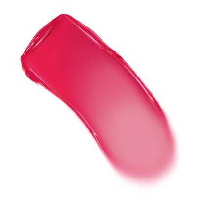 Girls Night shade swatch of ColourPop Lip and Cheek Balm sweeps in a curved stroke, revealing vibrant fuchsia-pink with a creamy, glossy finish that fades to a soft pink edge on a clean white background.