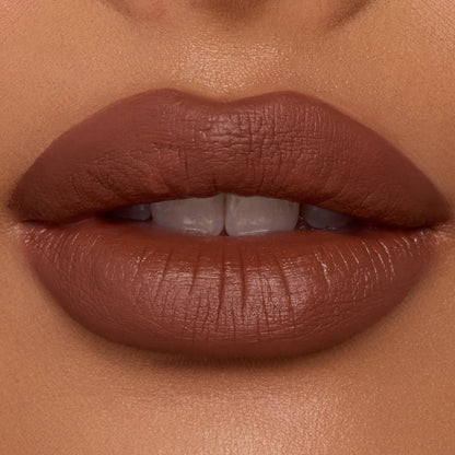 Lips wearing ColourPop Ultra Blotted Lip in Espresso Martini, a warm espresso-brown shade, shown close-up to showcase its soft-matte blotted finish and smooth, even coverage under studio lighting.