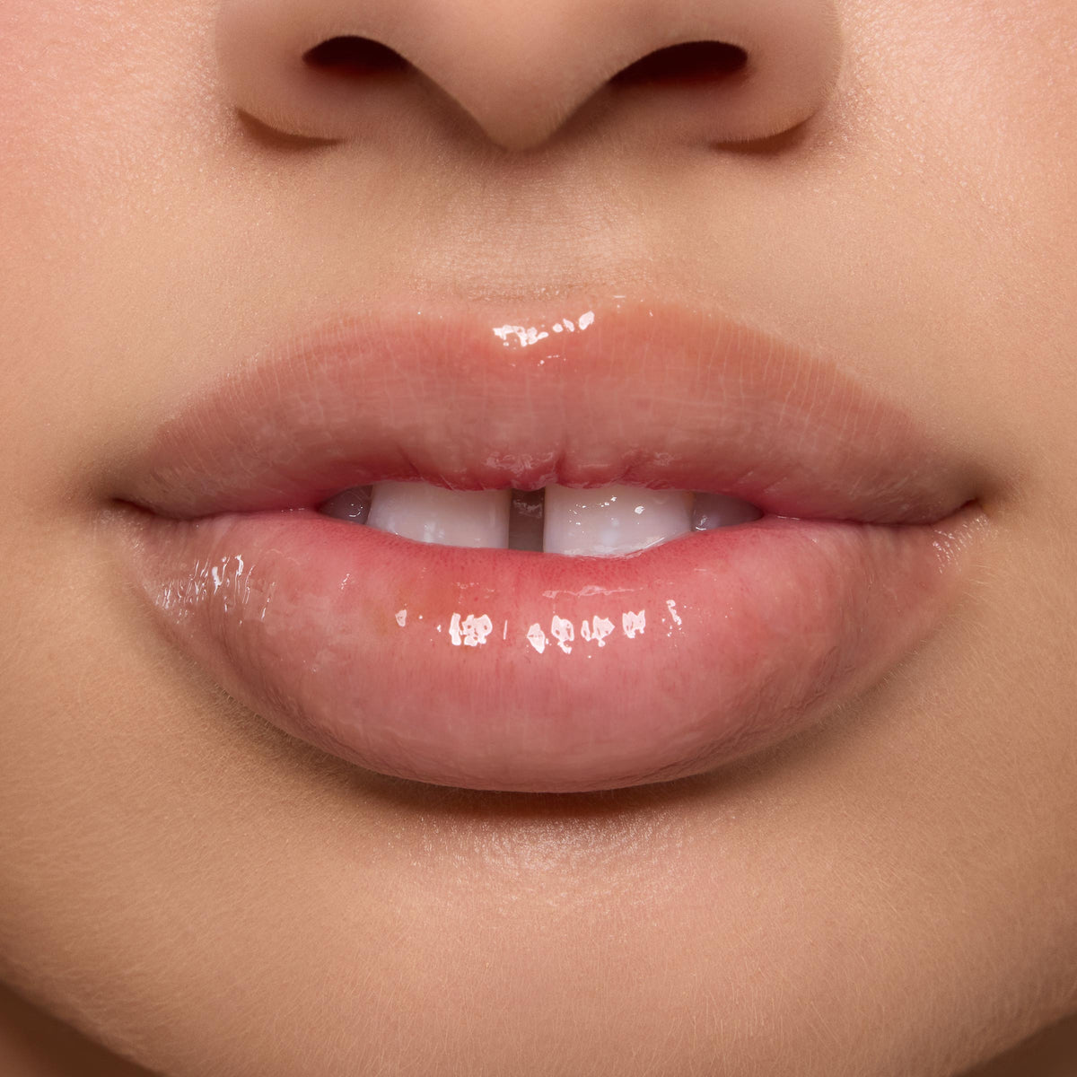 Shiny, moisturized lips wearing the Orange Vanilla Lip Mask in a tight studio close-up, highlighting high gloss and smooth texture as part of the ColourPop Lip Care Kit.