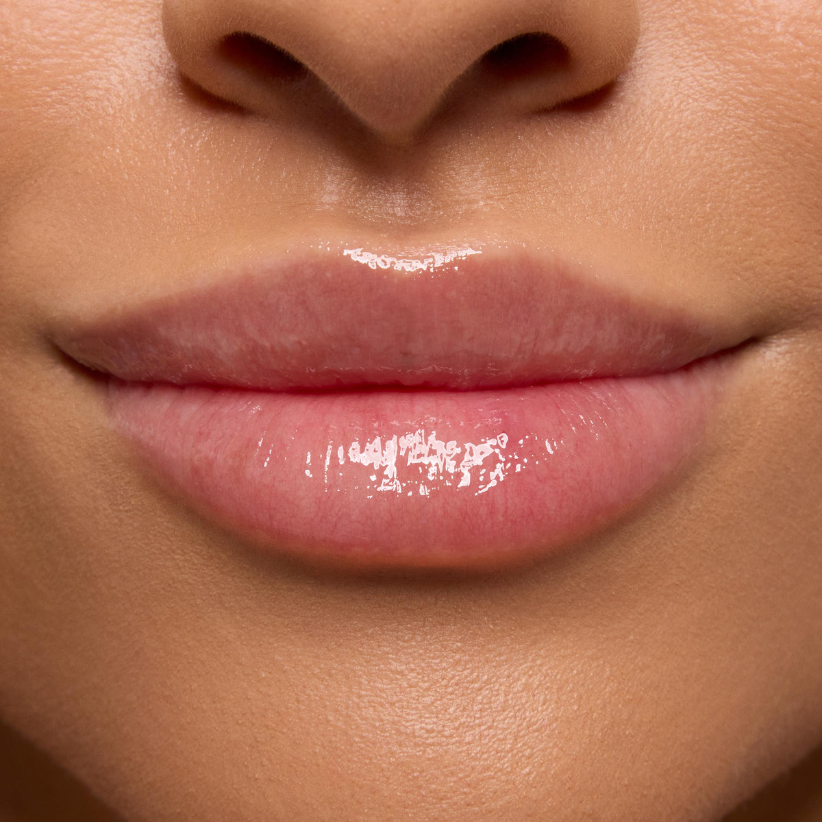 Glossy, hydrated pink lips showing a smooth, plumped finish, demonstrating the Strawberry Feels ColourPop Lip Care Kit in a tight close-up of the lower face with natural skin tone.