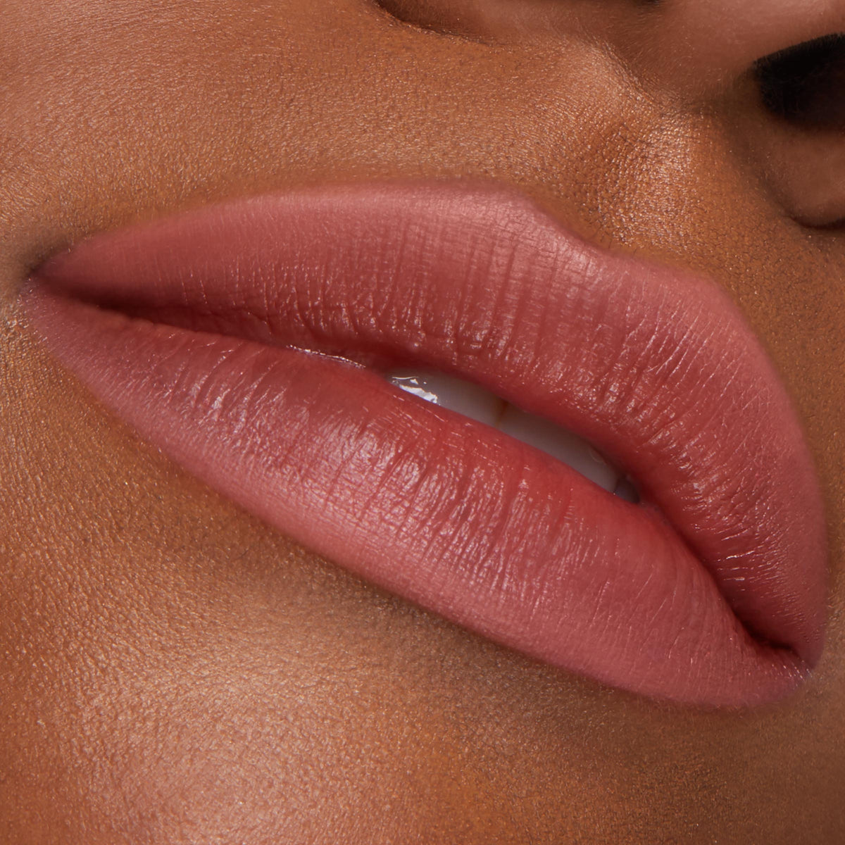 Lips wearing the Five Stars shade, lined and filled with the ColourPop Lippie Pencil, showing a rosy terracotta hue and precise definition in a tight close-up on smooth skin.