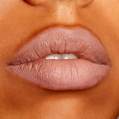 Lips wearing ColourPop Lippie Pencil Cool BFF, outlining and filling a cool nude mauve shade with a soft matte finish, shown in an extreme close-up beauty swatch for precise lip definition.