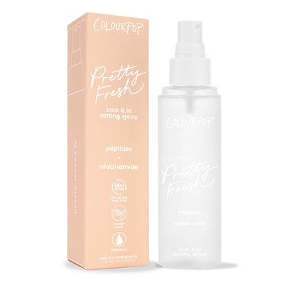 ColourPop Pretty Fresh Setting Spray Lock It In bottle stands beside a peach box on white, a frosted 3.4 fl oz mister with peptides and niacinamide, offering 16-hour wear, transfer-proof, waterproof makeup hold.
