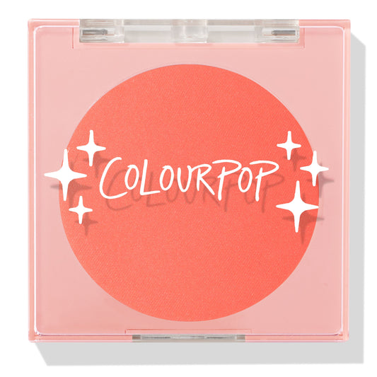 Papaya pressed powder blush sits as a vivid coral pan in a closed translucent pink square compact, featuring the COLOURPOP logo and white star accents; ColourPop Pressed Powder Blush for a warm, bright cheek flush.