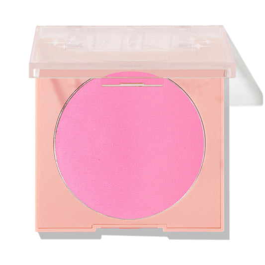 Prairie Air ColourPop Pressed Powder Blush presenting a vivid cool‑toned pink round pan in a pastel peach square compact with a clear, half‑closed lid, shown against a white background for a clean product shot.
