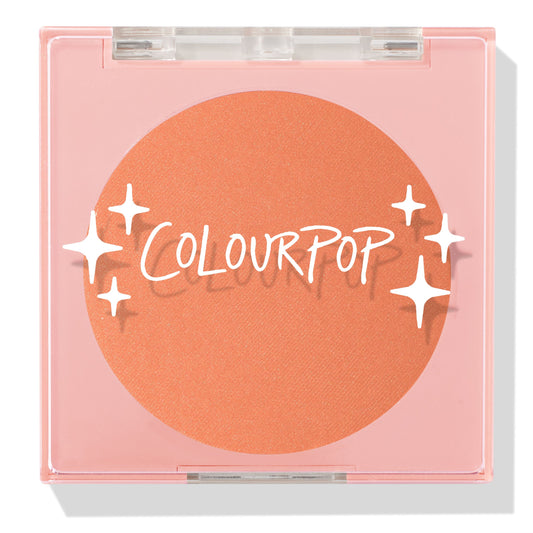 ColourPop Pressed Powder Blush Pretty Toasty compact displaying a warm toasted peach pan, closed under a clear lid with white sparkles logo, set in a pale pink square case for travel-friendly, everyday makeup.