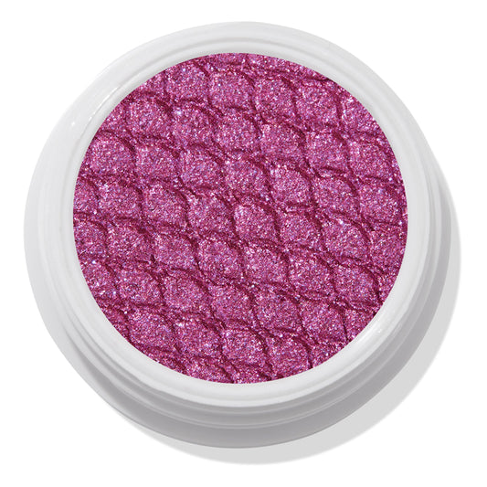 Pug Life ColourPop Super Shock Shadow showcasing a shimmering fuchsia-pink pan with silvery violet sparkle, embossed in a scaled quilt pattern, sitting in an open white single pot against a clean studio white background.